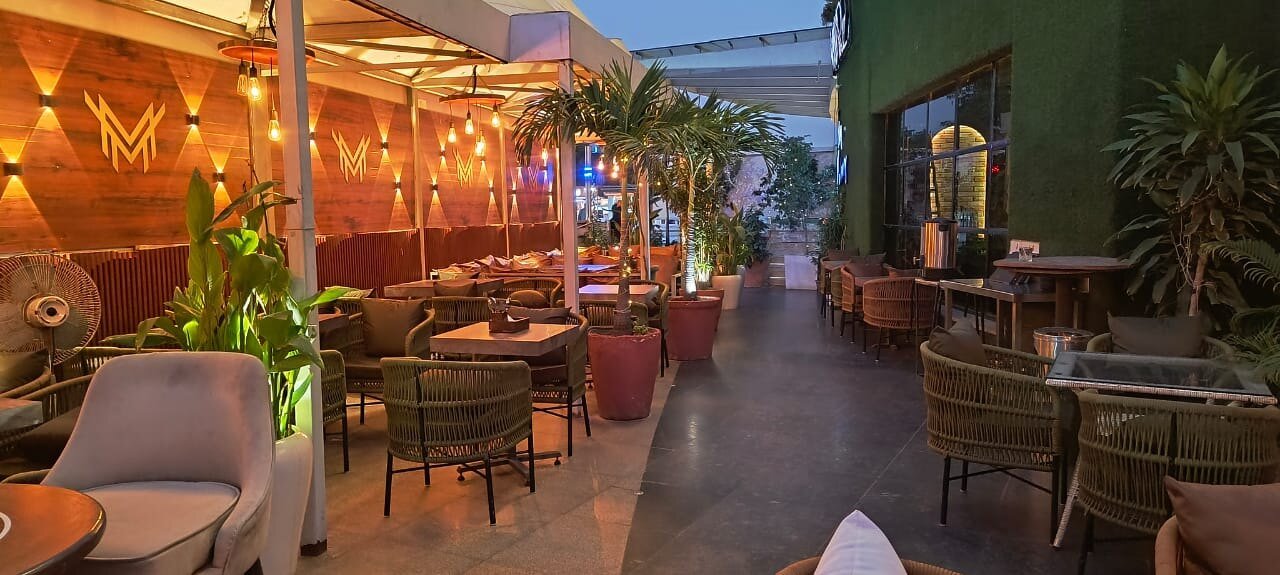 Moire open-air lounge seating and greenery